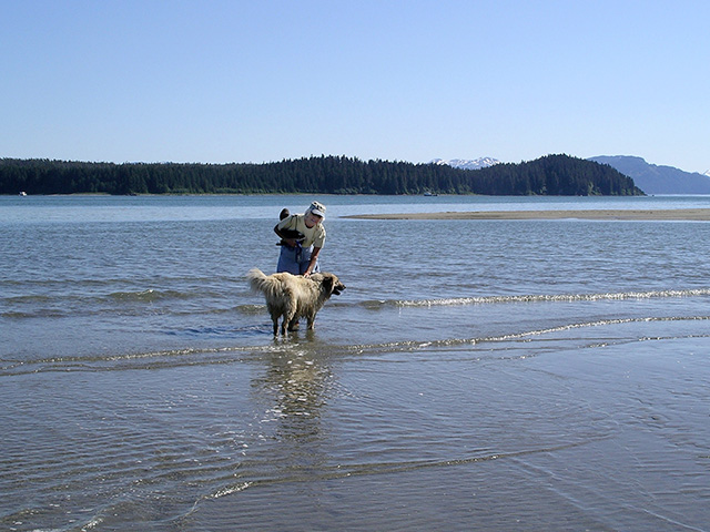 My sister-in-law, Connie, walking the Gustavus beach at low tide, 2004, Pleasant Island in the background